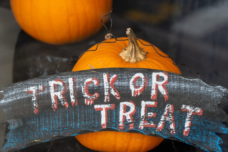 trick or treat sign with pumpkins